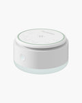 Momcozy Portable Baby Sound Machine - White and blue design, for baby sleep. Includes control buttons and brand logo.